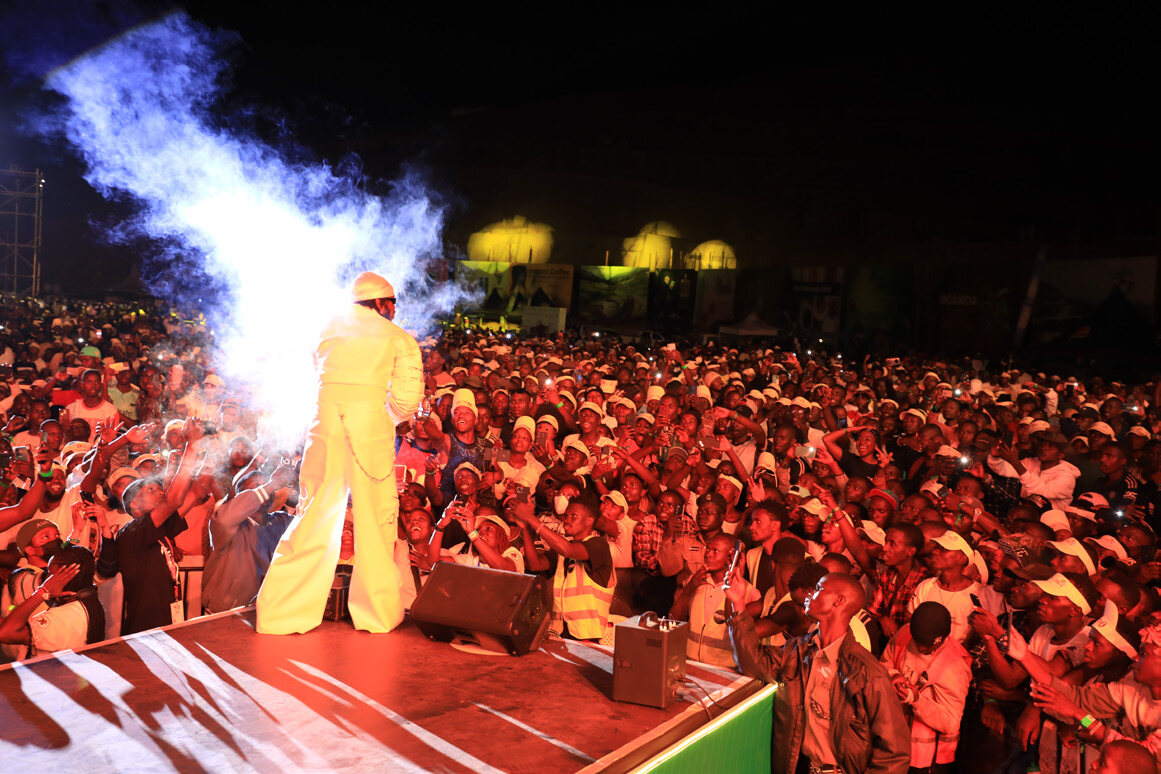 Performer entertaining a large concert crowd